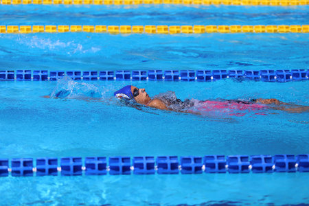 ISTANBUL, TURKEY - AUGUST 16, 2015: Unidentified competitor swims at the Turkcell Turkish Swimming Championship in Enka Sports Centerのeditorial素材