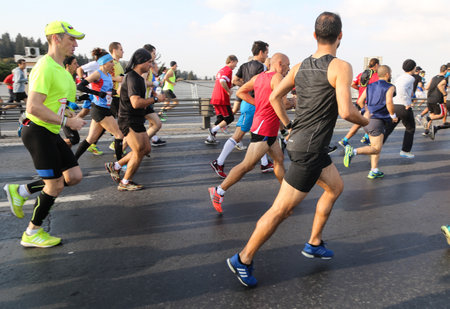 ISTANBUL, TURKEY - NOVEMBER 15, 2015: People are crossing the Bosphorus Bridge from Asia to Europe during 37th Istanbul Marathon. More than 100000 people attended to marathon, 15K, 10K and fun run.のeditorial素材