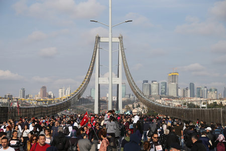 ISTANBUL, TURKEY - NOVEMBER 15, 2015: People are crossing the Bosphorus Bridge from Asia to Europe during 37th Istanbul Marathon. More than 100000 people attended to marathon, 15K, 10K and fun run.のeditorial素材
