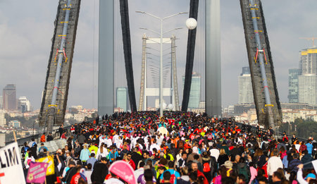ISTANBUL, TURKEY - NOVEMBER 15, 2015: People are crossing the Bosphorus Bridge from Asia to Europe...