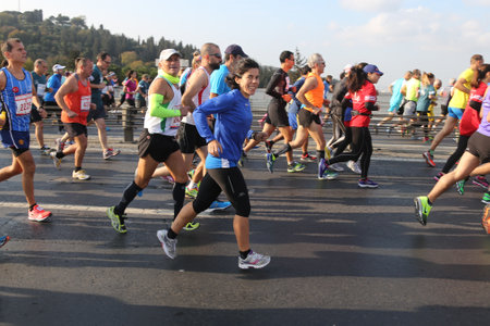 ISTANBUL, TURKEY - NOVEMBER 15, 2015: People are crossing the Bosphorus Bridge from Asia to Europe during 37th Istanbul Marathon. More than 100000 people attended to marathon, 15K, 10K and fun run.のeditorial素材