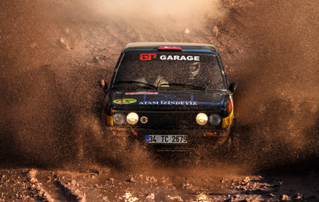 ISTANBUL, TURKEY - NOVEMBER 14, 2015: Eris Okutan drives Murat 131 in Isok Istanbul Rally 2015, Gocbeyli stageのeditorial素材