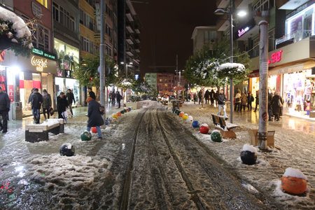 ISTANBUL, TURKEY - DECEMBER 31, 2015: Bahariye Street in Kadikoy covered with first snow of season. Bahariye Street is one of the most populer shopping area in Istanbul.のeditorial素材