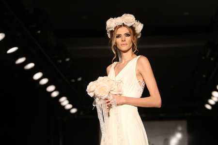 ISTANBUL, TURKEY - JANUARY 31, 2016: A model showcases one of the latest creations of Seren Moda during Weeding Fair.のeditorial素材