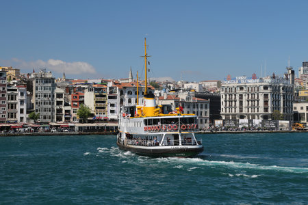 ISTANBUL, TURKEY - APRIL 30, 2016: Sehir Hatlari ferry passing from Asian side to European side of Istanbul. Sehir Hatlari was established in 1844 and now carry 150,000 passengers a day.のeditorial素材