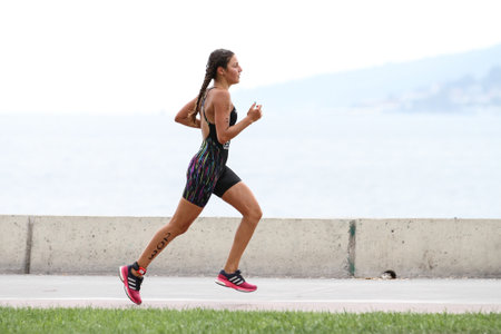 ISTANBUL, TURKEY - AUGUST 21, 2016: Athletes competing in running component of Istanbul Triathlon in Marmara Sea coast. 586 triathletes attempt to sixth Istanbul Thriathlon.のeditorial素材