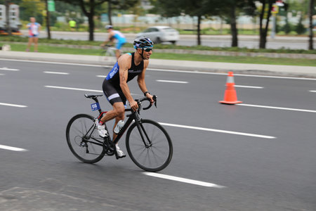 ISTANBUL, TURKEY - AUGUST 21, 2016: Athletes competing in cycling component of Istanbul Triathlon in Marmara Sea coast. 586 triathletes attempt to sixth Istanbul Thriathlon.のeditorial素材