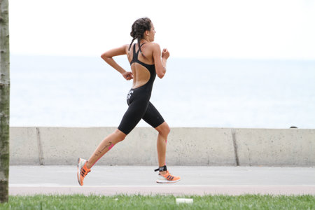 ISTANBUL, TURKEY - AUGUST 21, 2016: Athletes competing in running component of Istanbul Triathlon in Marmara Sea coast. 586 triathletes attempt to sixth Istanbul Thriathlon.のeditorial素材