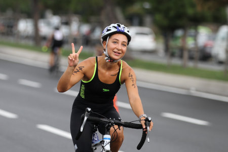 ISTANBUL, TURKEY - AUGUST 21, 2016: Athletes competing in cycling component of Istanbul Triathlon in Marmara Sea coast. 586 triathletes attempt to sixth Istanbul Thriathlon.のeditorial素材