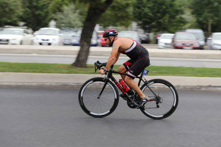 ISTANBUL, TURKEY - AUGUST 21, 2016: Athletes competing in cycling component of Istanbul Triathlon in Marmara Sea coast. 586 triathletes attempt to sixth Istanbul Thriathlon.のeditorial素材