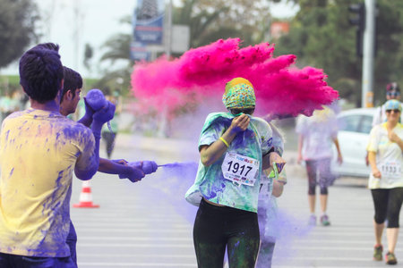 ISTANBUL, TURKEY - OCTOBER 09, 2016: People have fun in colors during Color Sky 5K run in Istanbul