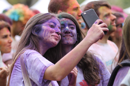 ISTANBUL, TURKEY - OCTOBER 09, 2016: Girl take selfie in colors during Color Sky 5K run in Istanbul