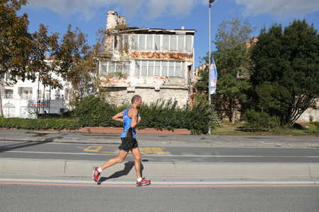 ISTANBUL, TURKEY - NOVEMBER 13, 2016: Athlete running in 38. Istanbul marathon which includes two continents in one race. Marathon starts on the Asian side and finishs in European side of Istanbul.のeditorial素材