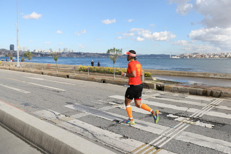 ISTANBUL, TURKEY - NOVEMBER 13, 2016: Athlete running in 38. Istanbul marathon which includes two continents in one race. Marathon starts on the Asian side and finishs in European side of Istanbul.のeditorial素材
