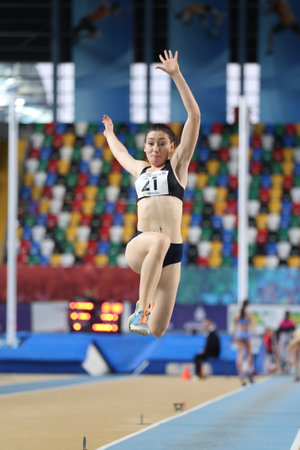 ISTANBUL, TURKEY - FEBRUARY 05, 2017: Athlete Tugba Danismaz long jumping during Turkcell Turkish Youth Indoor Championshipsのeditorial素材