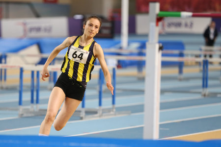 ISTANBUL, TURKEY - FEBRUARY 05, 2017: Athlete Rumeysa Oktem high jumping during Turkcell Turkish Youth Indoor Championshipsのeditorial素材