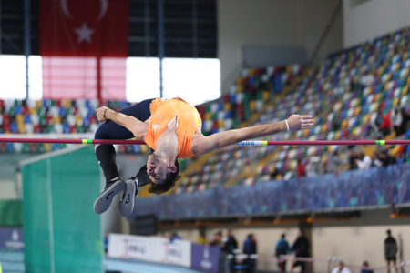 ISTANBUL, TURKEY - FEBRUARY 04, 2017: Athlete Alperen Acet high jumping during Turkcell Turkish Youth Indoor Championshipsのeditorial素材