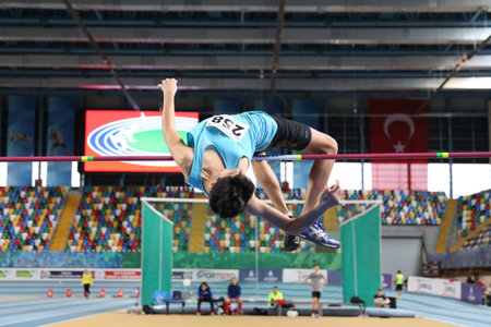 ISTANBUL, TURKEY - FEBRUARY 04, 2017: Athlete Adil Karakas high jumping during Turkcell Turkish Youth Indoor Championshipsのeditorial素材
