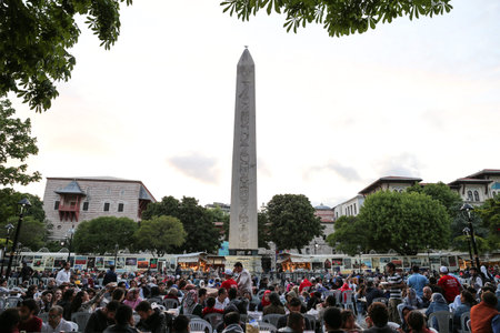 ISTANBUL, TURKEY - MAY 27, 2017: People waiting for the evening meal during Ramadan in Sultanahmet square. Sultanahmet district is the most populer place for Ramadan activities in Istanbul.のeditorial素材