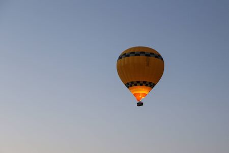 Hot Air Balloon Over Goreme Town, Turkeyの写真素材