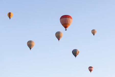 Hot Air Balloons Over Goreme Town, Turkeyの写真素材