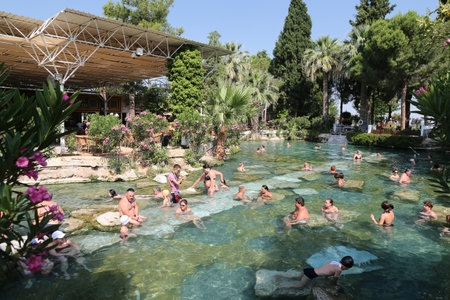DENIZLI, TURKEY - JUNE 16, 2017: People in Antique Pool of Hierapolis Ancient City in Pamukkale. Pool was shaped by the earthquake which happened in the 7th century AD.のeditorial素材