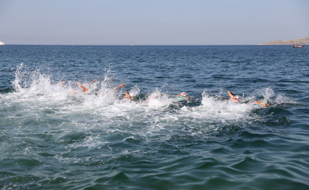 ISTANBUL, TURKEY - JULY 30, 2017: Athletes competing in swimming component of Istanbul Beylikduzu ETU Triathlon European Cup.のeditorial素材