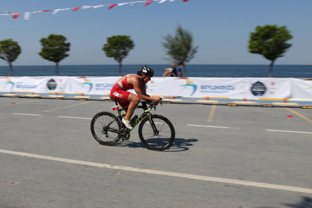 ISTANBUL, TURKEY - JULY 30, 2017: Athlete competing in cycling component of Istanbul Beylikduzu ETU Triathlon European Cup.のeditorial素材