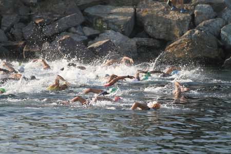 ISTANBUL, TURKEY - AUGUST 13, 2017: Athletes competing in swimming component of Istanbul Kartal Triathlon.のeditorial素材
