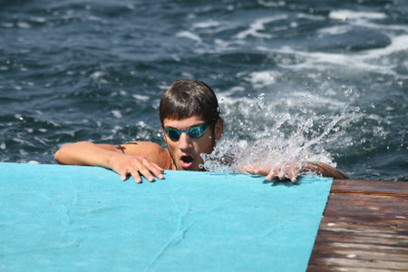 ISTANBUL, TURKEY - AUGUST 13, 2017: Athletes competing in swimming component of Istanbul Kartal Triathlon.のeditorial素材