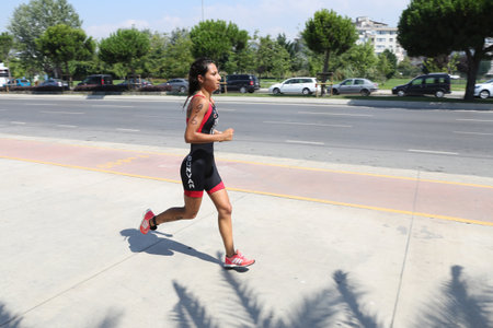 ISTANBUL, TURKEY - AUGUST 13, 2017: Athletes competing in running component of Istanbul Kartal Triathlon.のeditorial素材