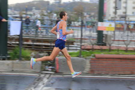 ISTANBUL, TURKEY - NOVEMBER 12, 2017: Athlete running in 39. Istanbul marathon which includes two continents in one race. Marathon starts on the Asian side and finishs in European side of Istanbul.のeditorial素材