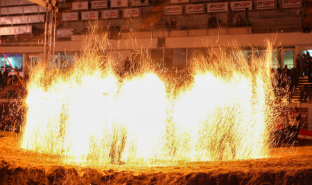 ISTANBUL, TURKEY - NOVEMBER 25, 2017: Fire dancers perform during Istanbul Superenduro championship in Atakoy Athletics Arena.のeditorial素材