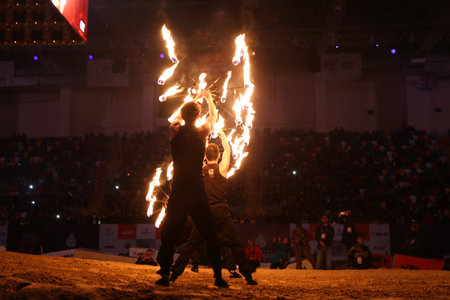ISTANBUL, TURKEY - NOVEMBER 25, 2017: Fire dancers perform during Istanbul Superenduro championship in Atakoy Athletics Arena.のeditorial素材