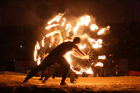 ISTANBUL, TURKEY - NOVEMBER 25, 2017: Fire dancers perform during Istanbul Superenduro championship in Atakoy Athletics Arena.のeditorial素材