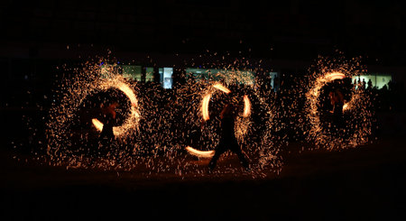 ISTANBUL, TURKEY - NOVEMBER 25, 2017: Fire dancers perform during Istanbul Superenduro championship in Atakoy Athletics Arena.のeditorial素材