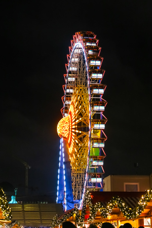 Colorful Ferris Wheel in Neptunbrunnen Christmas Market in Berlin, Germanyの写真素材