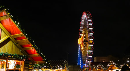 Colorful Ferris Wheel in Neptunbrunnen Christmas Market in Berlin, Germanyのeditorial素材