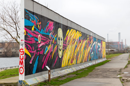 BERLIN, GERMANY - DECEMBER 16, 2017: Mural painted over Berlin Wall in East Side Gallery where the...