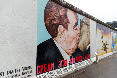 BERLIN, GERMANY - DECEMBER 16, 2017: Mural painted over Berlin Wall in East Side Gallery where the largest open air gallery in the worldのeditorial素材