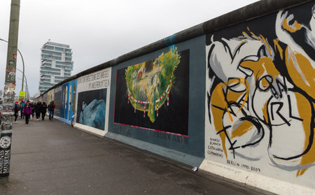 BERLIN, GERMANY - DECEMBER 16, 2017: Mural painted over Berlin Wall in East Side Gallery where the...