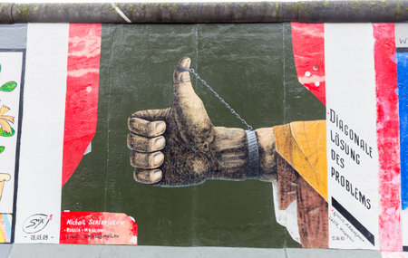 BERLIN, GERMANY - DECEMBER 16, 2017: Mural painted over Berlin Wall in East Side Gallery where the largest open air gallery in the worldのeditorial素材
