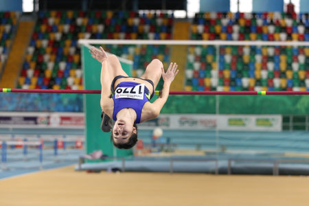 ISTANBUL, TURKEY - DECEMBER 24, 2017: Undefined athlete high jumping during Turkish Athletic Federation Indoor Athletics Record Attempt Racesのeditorial素材