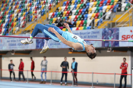 ISTANBUL, TURKEY - DECEMBER 23, 2017: Undefined athlete high jumping during Turkish Athletic...