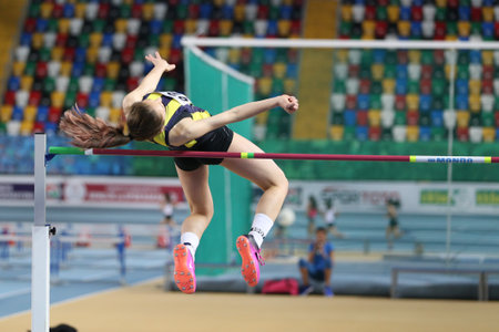 ISTANBUL, TURKEY - JANUARY 28, 2018: Undefined athlete high jumping during Turkcell Turkish U20 Indoor Athletics Championshipsのeditorial素材