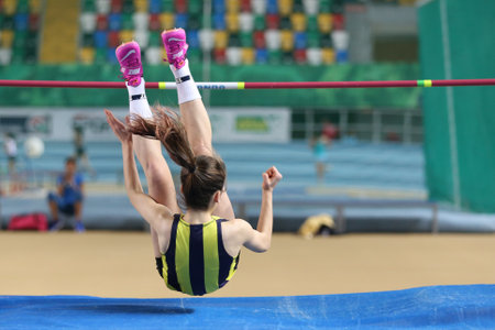 ISTANBUL, TURKEY - JANUARY 28, 2018: Undefined athlete high jumping during Turkcell Turkish U20 Indoor Athletics Championshipsのeditorial素材