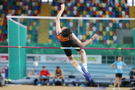 ISTANBUL, TURKEY - JANUARY 27, 2018: Undefined athlete high jumping during Turkcell Turkish U20...
