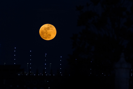 Super Blue Blood Moon Behind Bosphorus Bridge in Istanbul City, Turkeyの写真素材