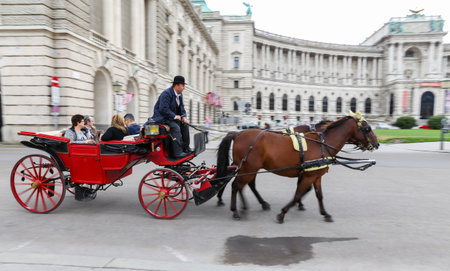 VIENNA, AUSTRIA - AUGUST 26, 2018: People touring in Coach in Hofburg palaceのeditorial素材