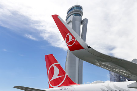 ISTANBUL, TURKEY - SEPTEMBER 23, 2018: Turkish Airlines Airplane in front of control tower of...